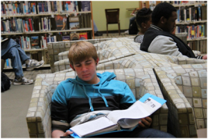 Davis High sophomore Jacob Fields studies for an upcoming World Civilizations test in the Davis Public Library while blasting classic rock. 