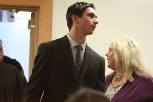 Davis resident Clayton Garzon, 20, enters the courtroom, accompanied by his lawyer, Linda Parisi.