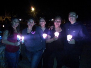 Members of Partida's family gathers holding the candles they lit in his honor. Partida is the victim of an alleged hate crime that targeted him for his sexual orientation. From left to right, the members of his family are: Leah Hernandez, Lorraine Casillas, Lisa Cervantes, Katrina Partida and Charlie Moore.