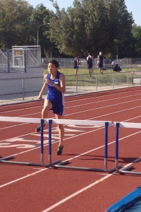 Sophomore Amanda Gong prepares to clear a hurdle in the frosh/soph 300 meter hurdle race. Gong won the race in 54.18 after having run a personal record in the 100 meter hurdle race earlier in the meet.  