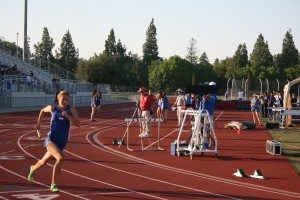 Senior Laney Teaford sprints the 4x4 for Women’s varsity at the last home track meet of the season. 