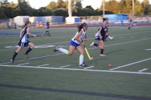Senior Jade Bugsch carries the ball downfield. Bugsch scored one of the two goals that helped carry Davis to victory.