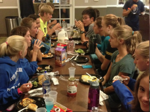 DHS cross-country members enjoy platefuls of pasta and glasses of chocolate milk on October 11 as they prepare for the Clovis Invitational. Many of the runners see this trip as an opportunity to bond with their teammates. 