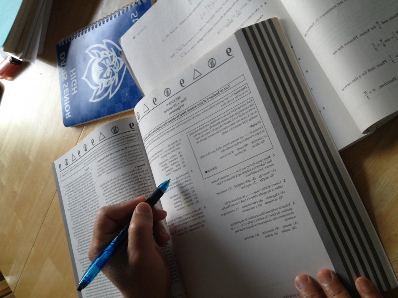 Many students took the SAT on Oct 5. In this photo illustration, a student studies for the SAT using one of the various prep books available.