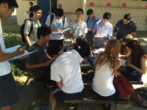 Students sign yearbooks during passing period. They share the memories they have had at DHS.