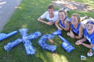 Senior Tyler Powell and juniors Vivi Kirsch, Abby Meyer and Sarah Sherwin show off their school spirit at the Pacific Tiger Invitational on Saturday, Sept. 27.