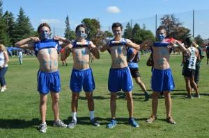 Junior Robbie Hughes and  seniors Jon Desideri, Jake Guida and Ben Hereen display their love for their coaches. Courtesy photo by Hallie Lassiter.