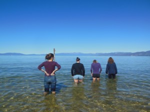 Seniors Danielle Schlenker, Kelly Strickland, Meg Robinson and Giulia McIsaac wade into Lake Tahoe on the last stop of the environmental science field trip. Students were granted an hour to rest on the beach and in the water before returning to Davis.