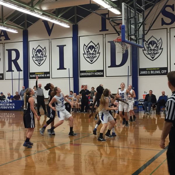 The women's varsity basketball team cruises to a win against Franklin earlier in the season. The Blue Devils had a much tougher game against St. Francis, but won 53-52.
