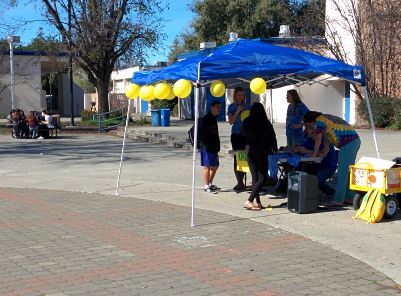 Members of student government set up a tent and speakers for the balloon stomp, which was the final event of Week of Kindness.