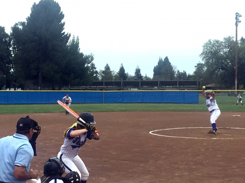 Sophomore Ashley Dufresne pitches to a Rocklin hitter. In the third inning, Dufresne threw out five hitters in a row but ran into trouble and allowed a few hits later in the game.