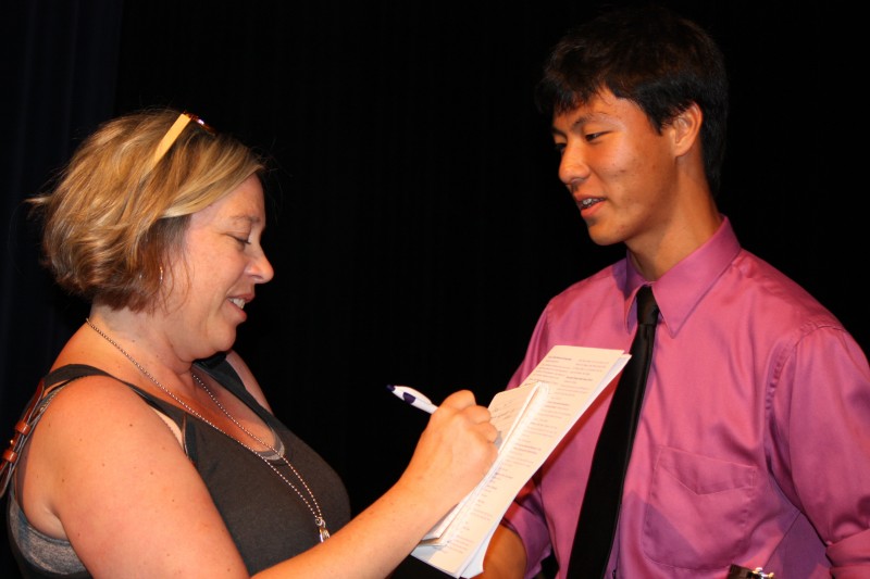 Rotary Scholarship Cup recipient, Alex Chen, talks to a reported after receiving many awards/scholarships.