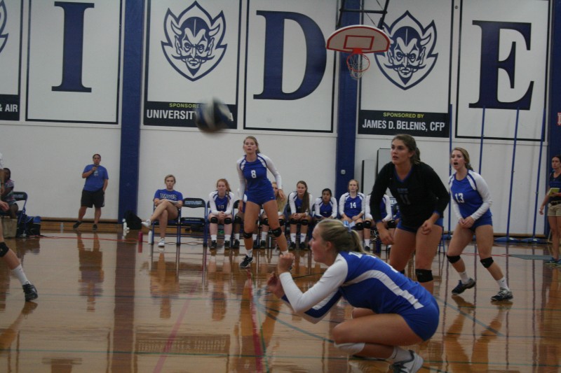 Junior Karlie Kijanka prepares for a hit as junior Sam Moore looks on in the Devils' win against Napa High on Thursday, Sept. 3.