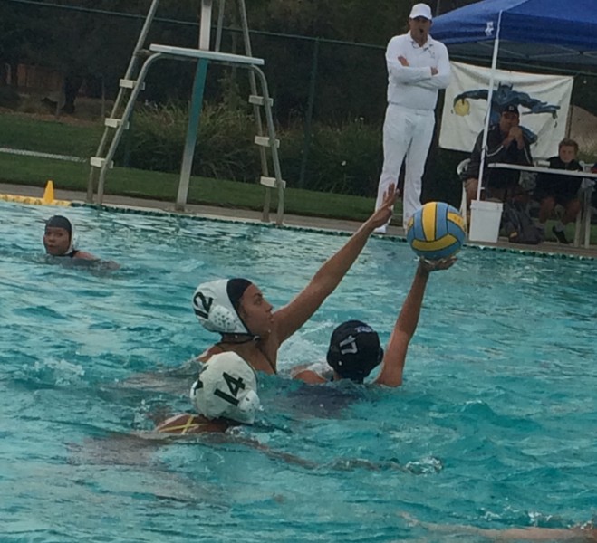 Photo caption: Junior Carissa Hernandez, number 17, looks for an open teammate at Wednesday’s water polo game against Monterey Trail.