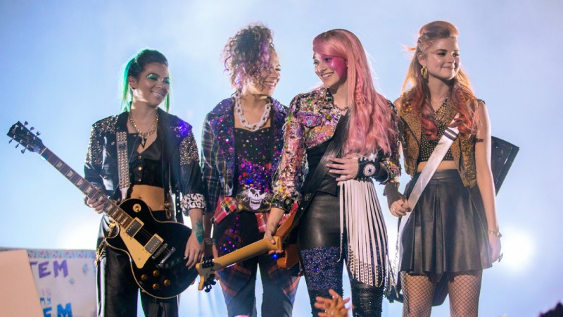 Caption: (From left to right) Aja (Hayley Kiyoko), Shana (Aurora Perrineau), Jem (Aubrey Peeples), and Kimber (Stefanie Scott) during one of their performances.  Photo courtesy of jemthemovie.com