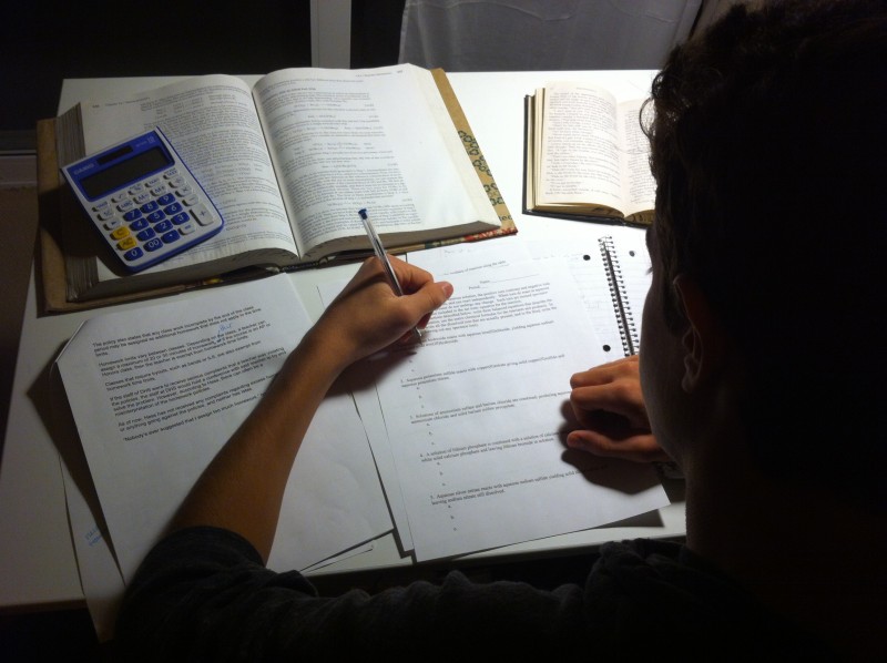 Photo illustration of a student completing his homework.