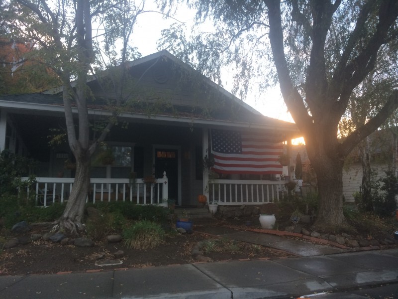 A neighborhood home on Tulip Lane displays the American flag in preparation for Veteran's Day.