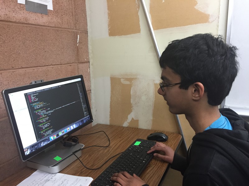 Sophomore Abhi Vemulapati works on programming for Davis High's robotics team, Citrus Circuits. (Photo illustration)