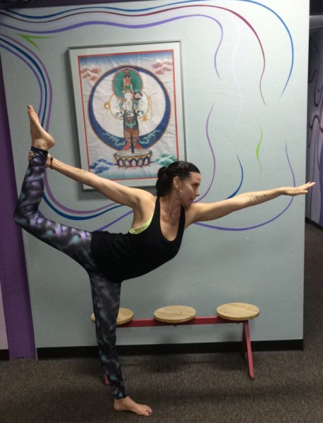 Yoga teacher Erin Dunning shows the yoga pose, Lord of the Dance.