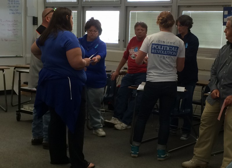 Voters in the deadlocked precinct discuss the merits of Sanders and Clinton.