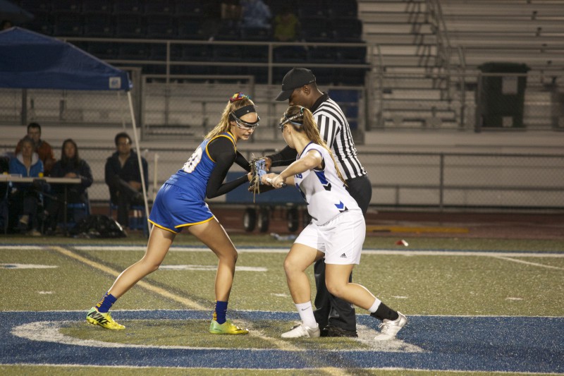 Senior Anna Belenis takes a draw against a Foothill Player. Davis beat Foothill 11-10 on Mar. 4.