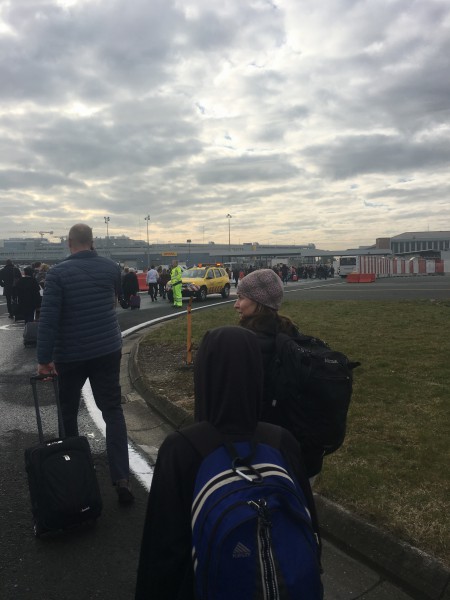 Fee and his mother, father, brother and sister evacuate the terminal and head to the Tarmac with thousands of others. (Courtesy: M. Fee)