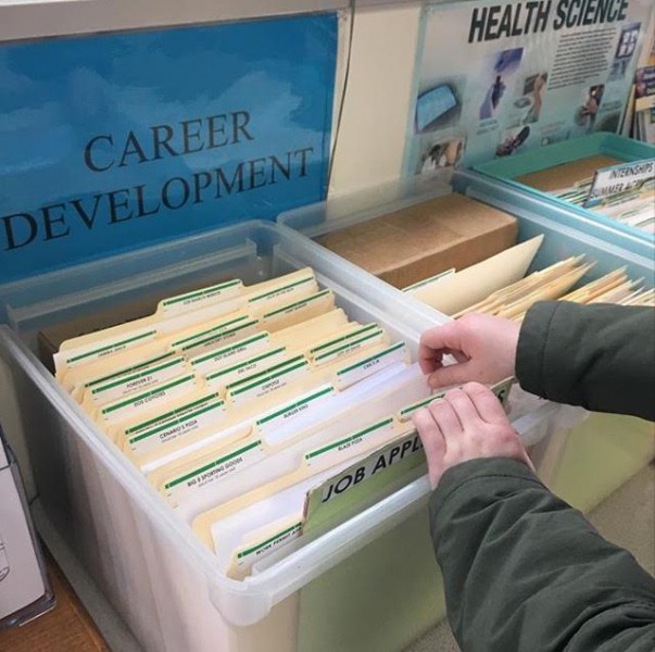 The career center, located in the library, contains a box full of job applications for high school students. (Photo illustration: C. Bachand) 