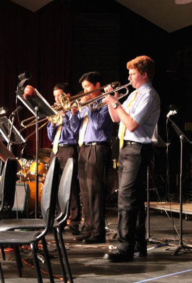 The trumpet section of The Amazing Harper Alumni Jazz Band stand during a previous "Coconut Grove" performance. (Photo: A Prime)