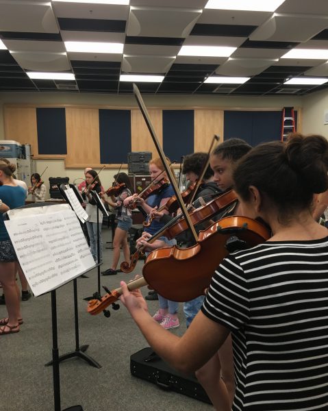 First period orchestra students practice for the Mark Wood Concert on May 14.