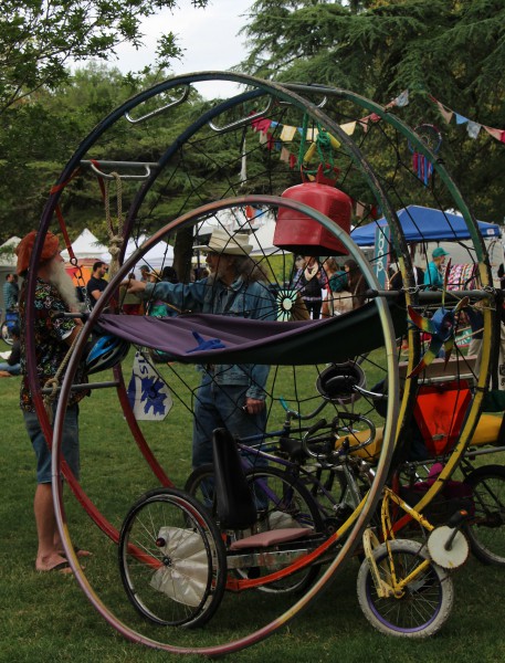 DHS substitute, Mr. Wagner, shows off one of his many homemade bikes to curious festival-goers.