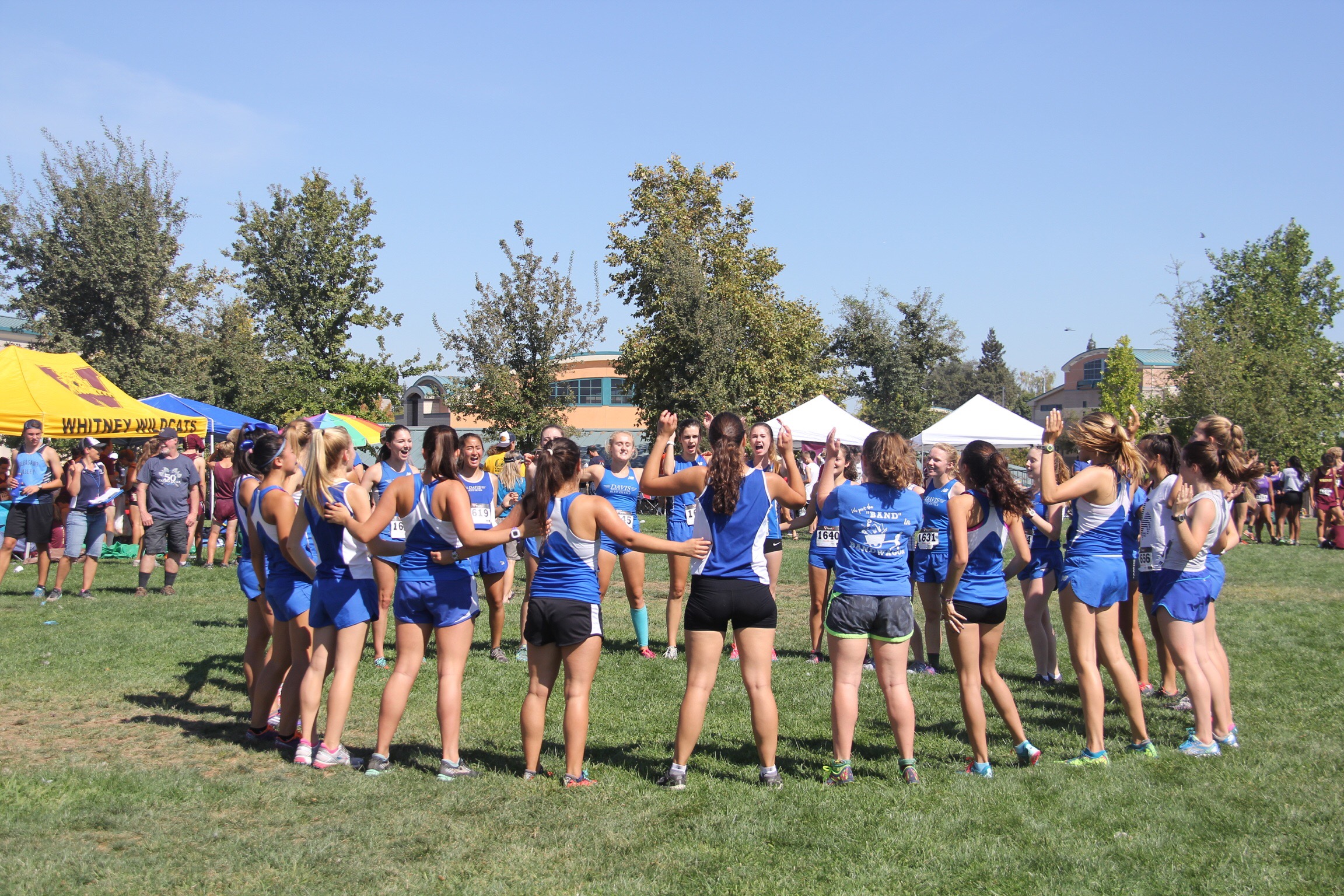 JV women prepare for their race with a cheer. Women's JV earned a perfect score of 15.
