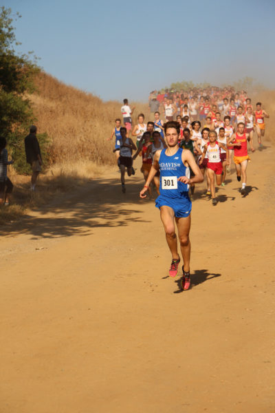 Michael Vernau leads the men’s varsity race and breaks his last year’s time of 15:00.6 with this year’s time of 14:52.4.