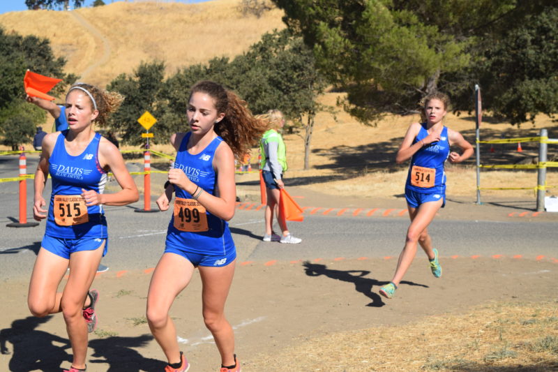 Sophomore Sophie Lodigiani races between sophomores Ruthie and Annie Mitchell at the first meet of the season in September: Lagoon Valley.