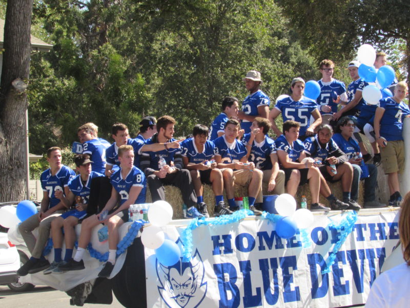 The Blue Devil football team waits for the homecoming parade to begin