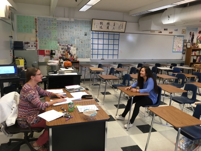 Janice Candelario and Esther Chan discuss issues concerning the Spanish Tutoring Club, including how to promote it, during their meeting on Oct. 13.