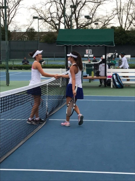 Sophomore Lillian Okamoto (left) and senior Lauren Duan shake hands after playing their semifinal match.