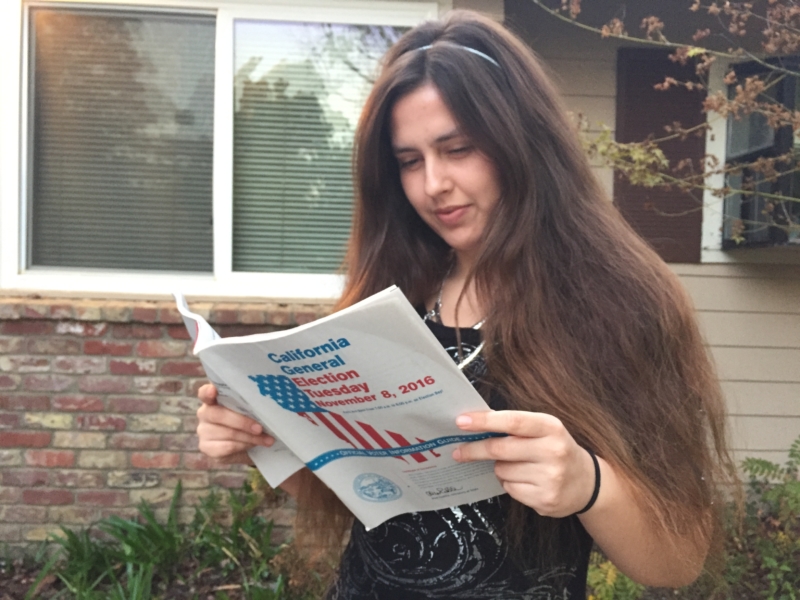 Senior Shailah Arreola-Bitner looks over the voter guide. 