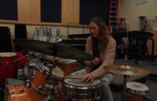 Junior Kalia Mitchell-Silbaugh, the percussionist in the “First Date” pit orchestra, practices in the music room.