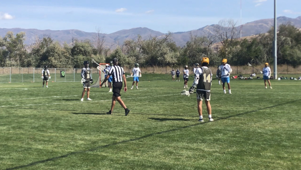 Senior Mason Johnstone and his team on the lacrosse field during a scrimmage game in Utah