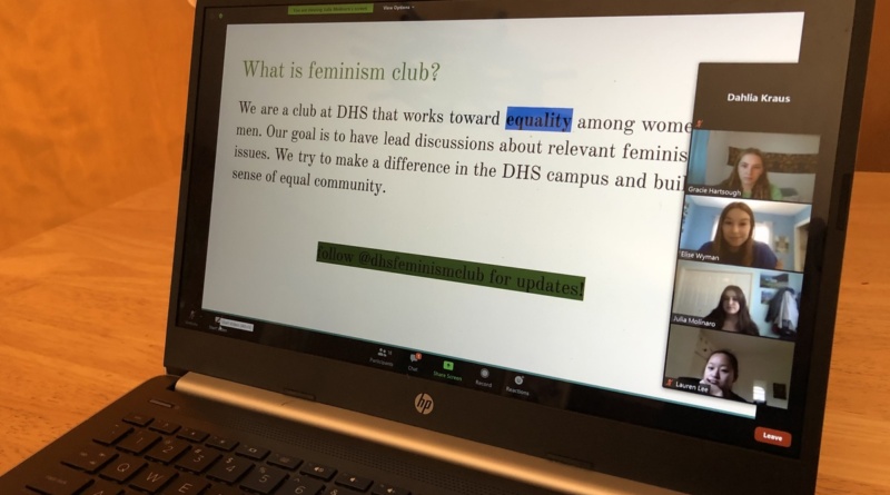 Feminism Club presidents share their screen of a presentation slide title "What is Feminism Club" during one of the club fair meetings