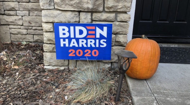 Biden Harris sign sits in front of a house