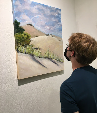 person looks at art