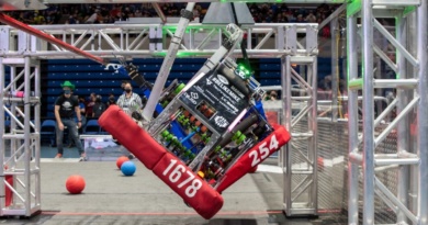 robot climbing across metal bars