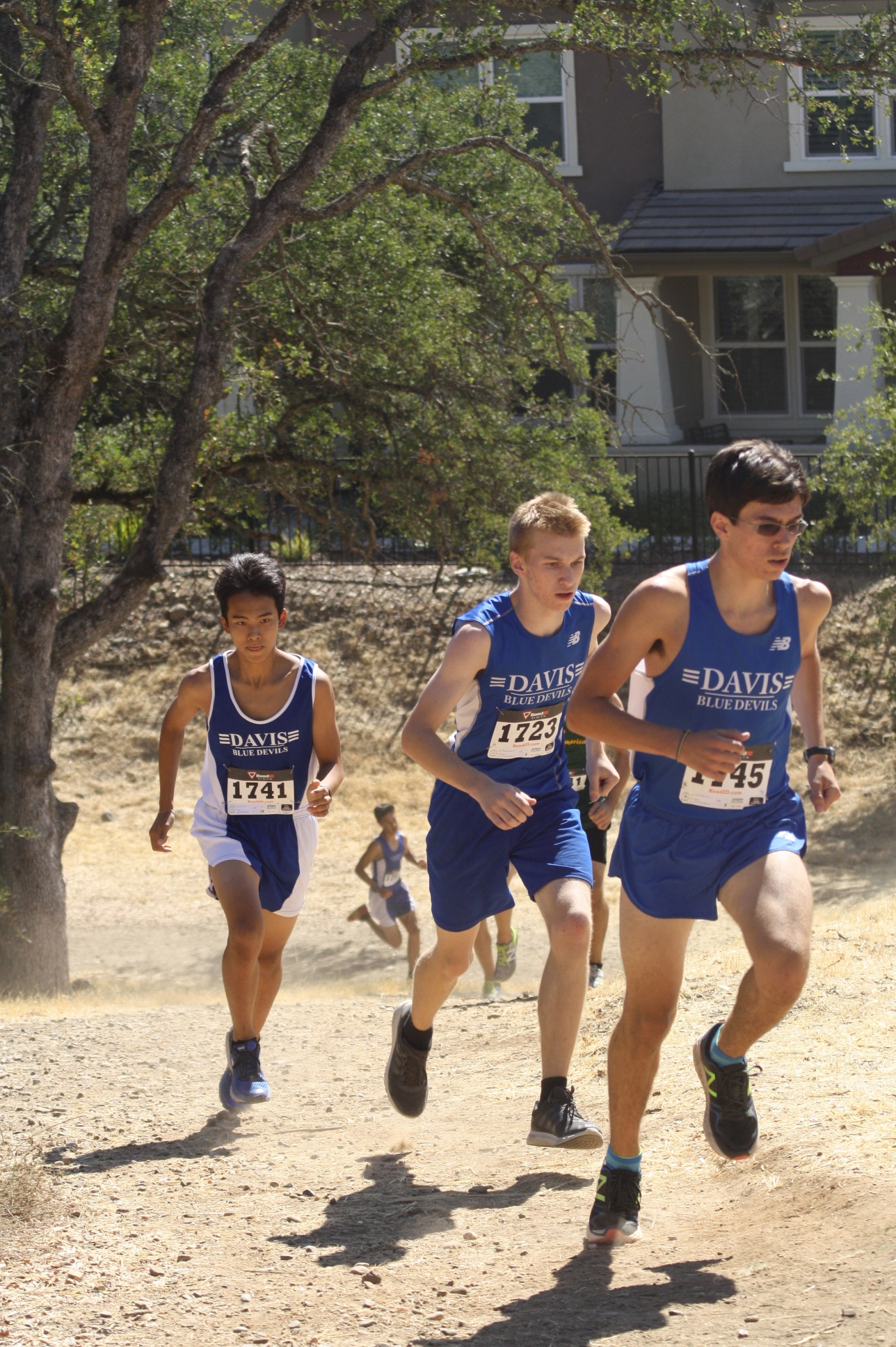 JV runners junior Perry Winsor, junior Stephen Nichols and senior Kyle Tran pace with each other during the first portion of the race.