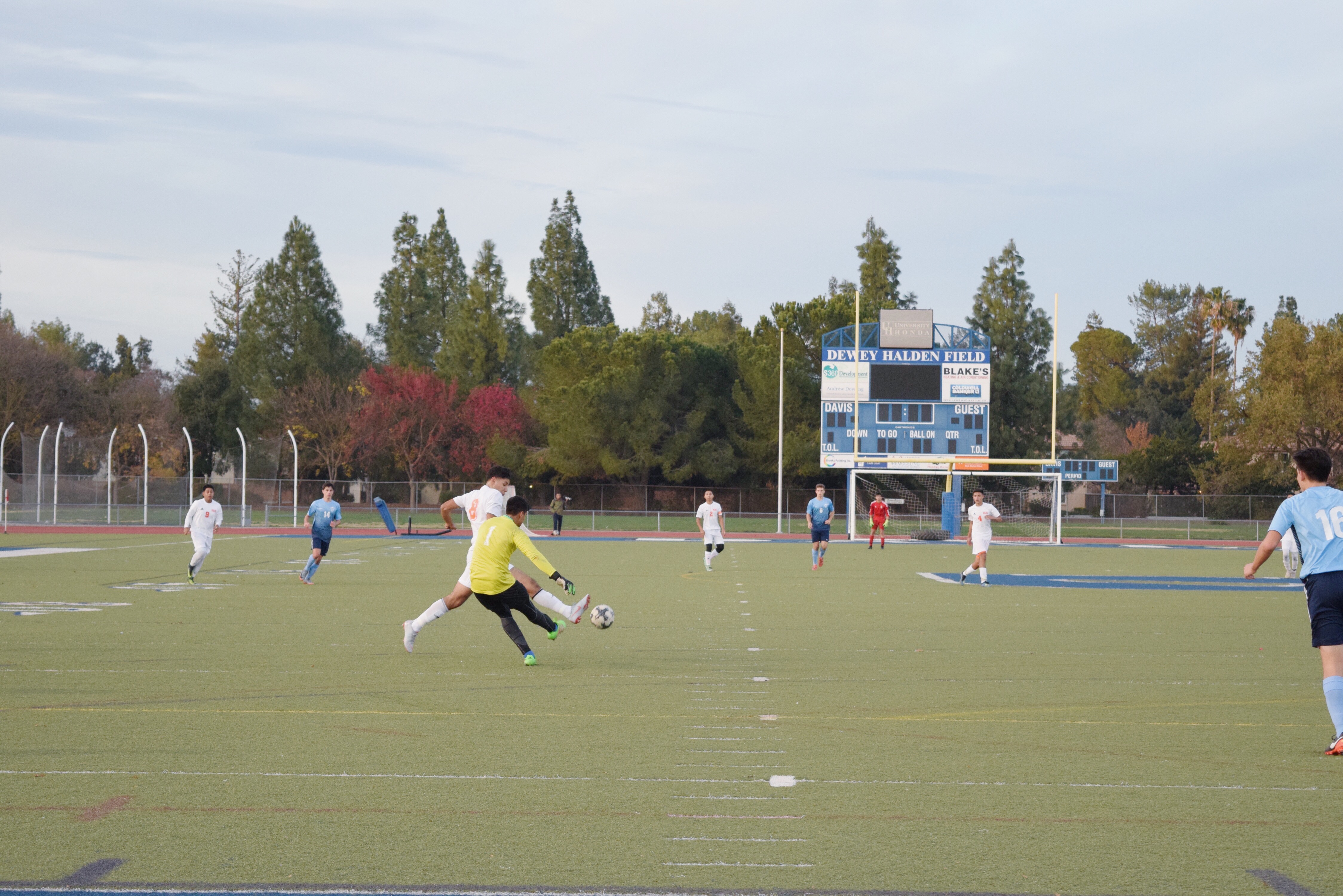 Goalkeeper Cory Kodira clears the ball away from a Woodland attacker.