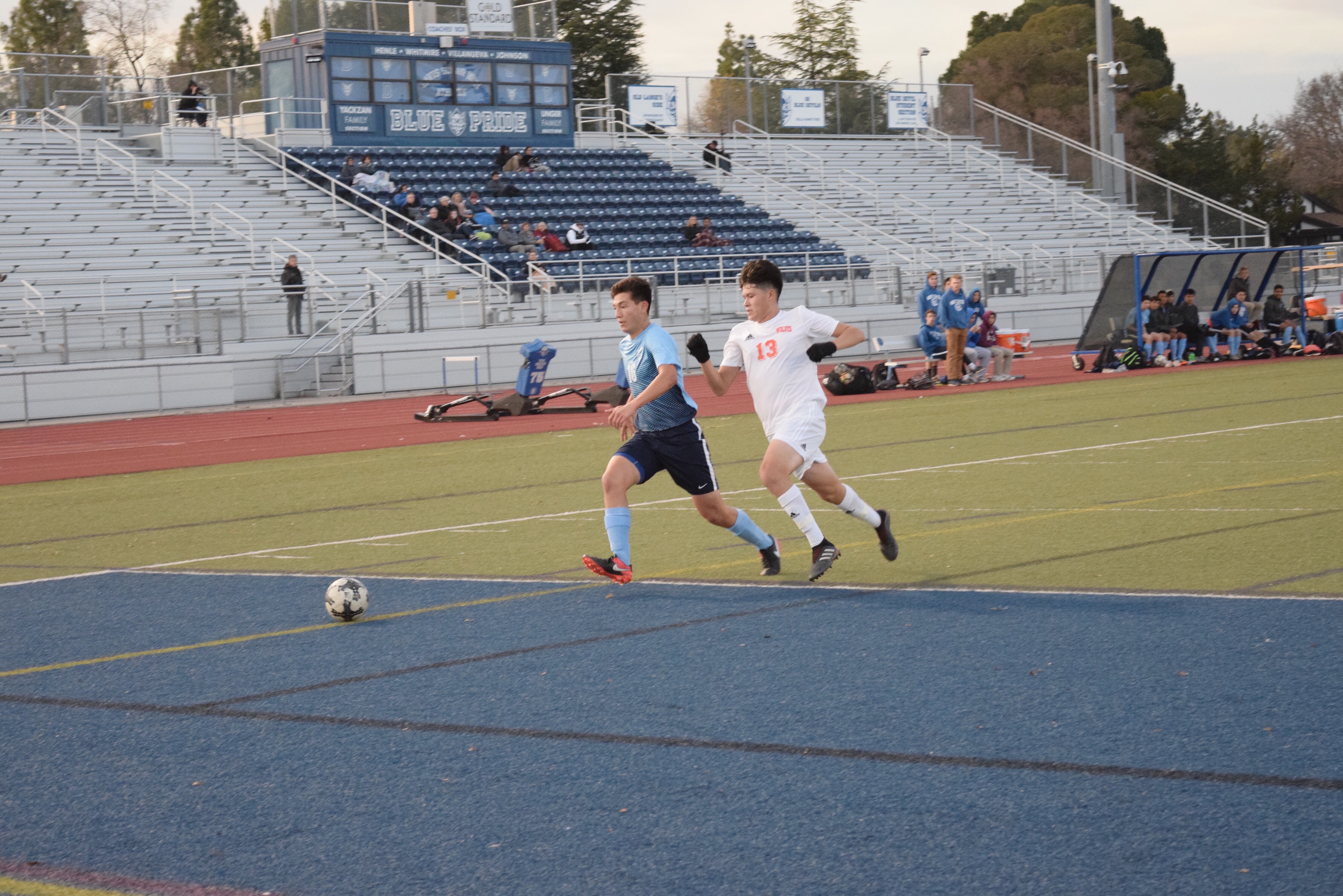 Senior Connor McCarty races for the ball down the sideline.
