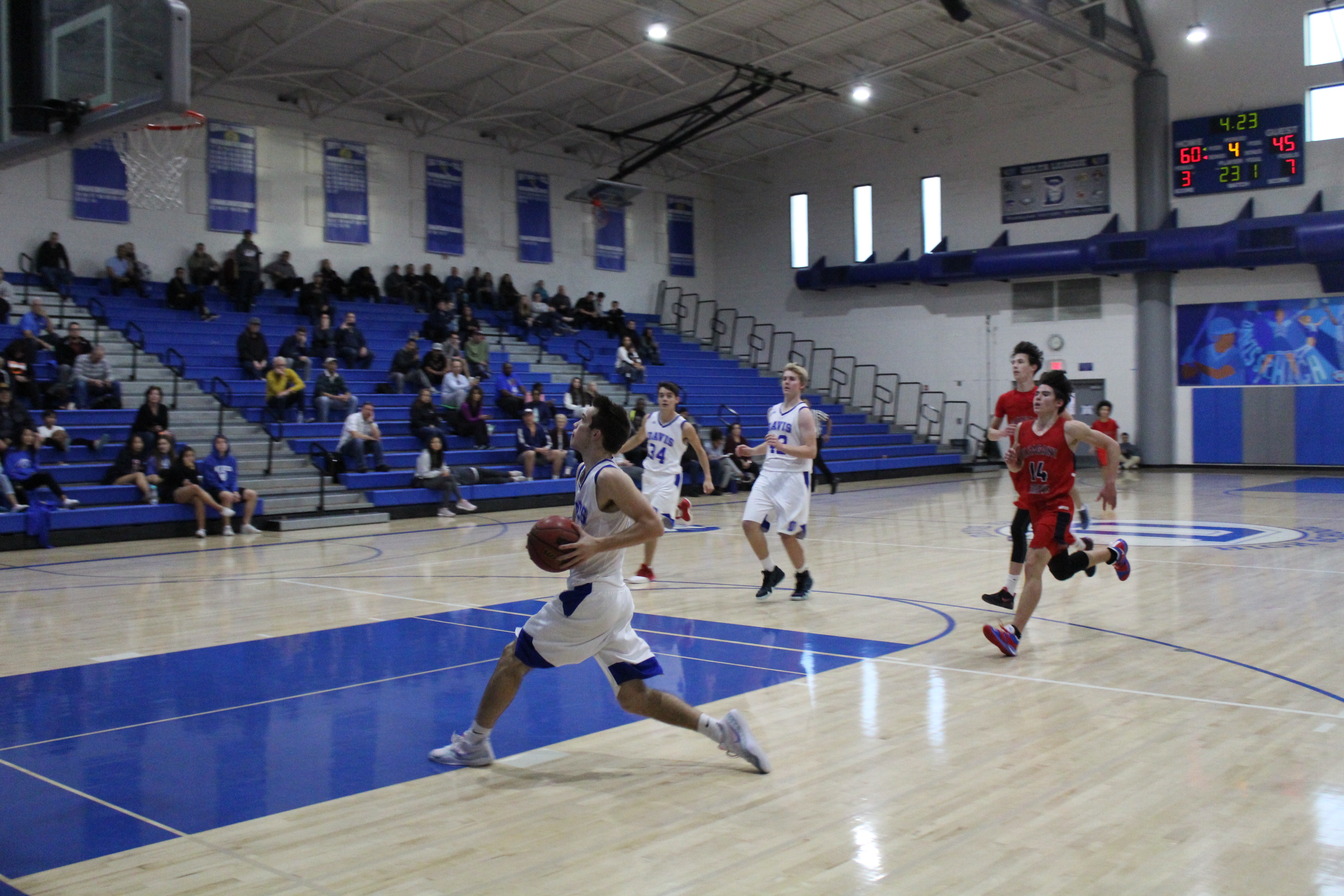 Junior Joey Voss strides toward the basket for two points.