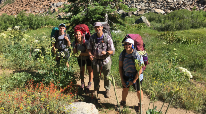 Senior Arianna Rosenberg with her family and friends on a backpacking trail
