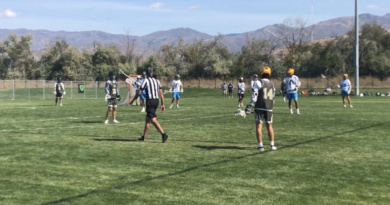 Senior Mason Johnstone and his team on the lacrosse field during a scrimmage game in Utah
