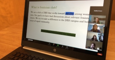 Feminism Club presidents share their screen of a presentation slide title "What is Feminism Club" during one of the club fair meetings